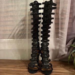 Tall black gladiator caged sandals.